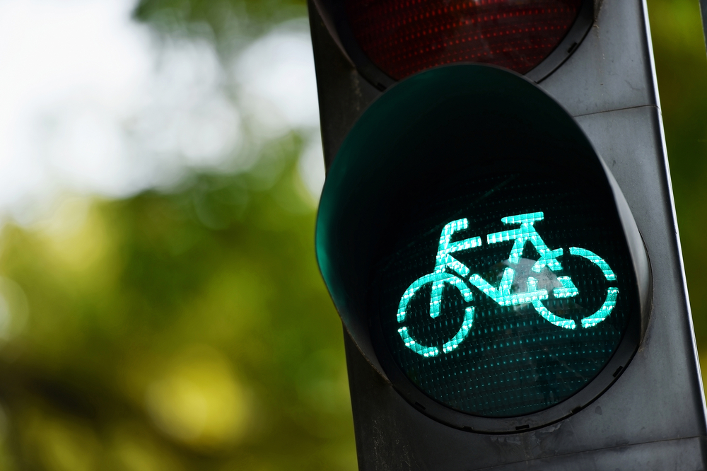 Detail shot with a bicycle traffic light switched to green colour