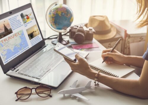Young women planning vacation trip